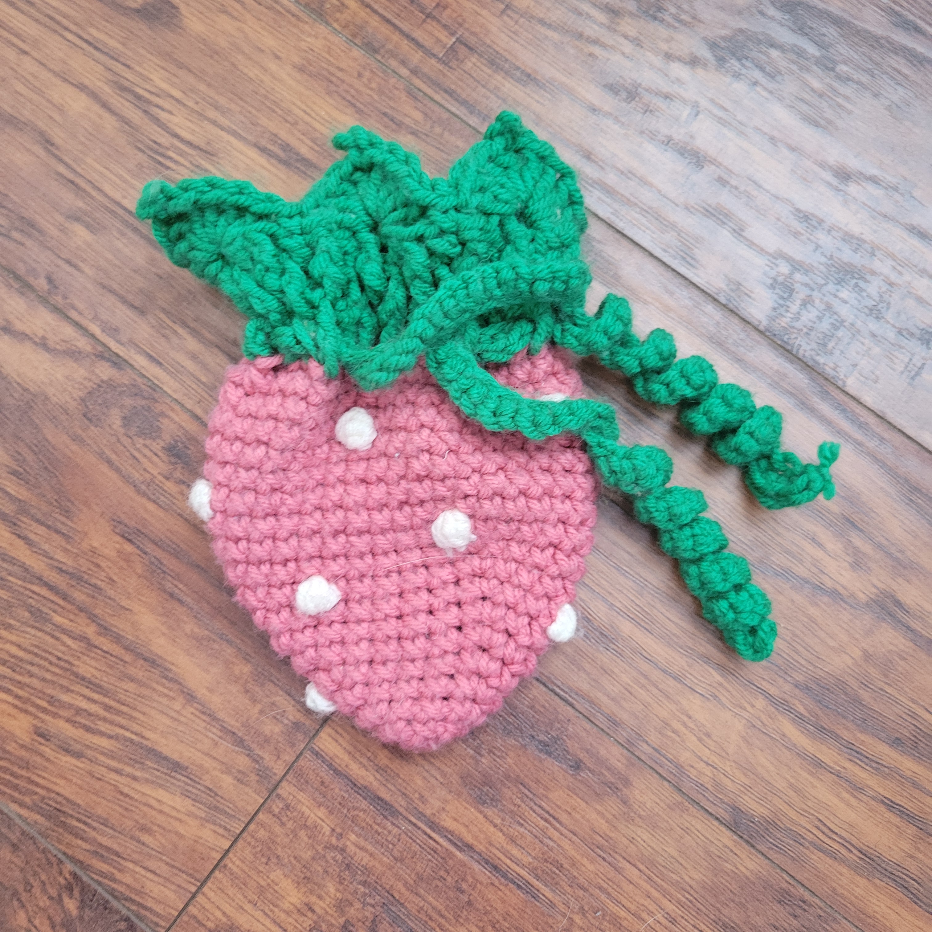 crochet strawberry dice bag flat lay