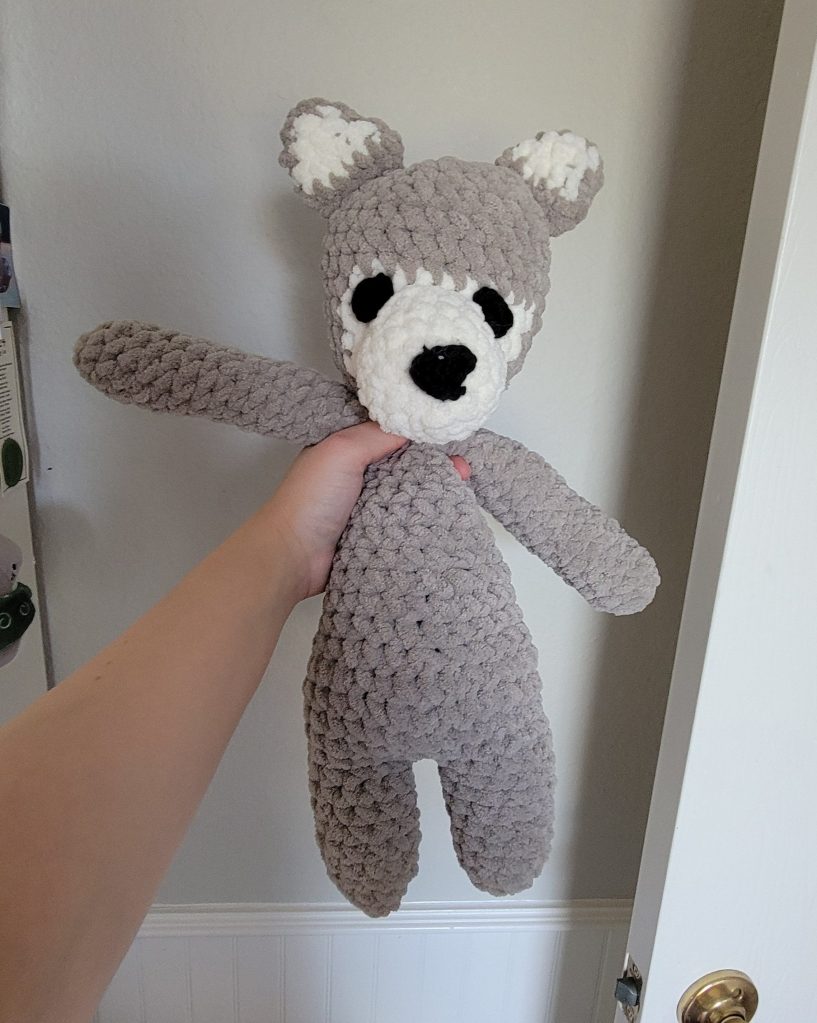 crochet wolf snuggler front, held