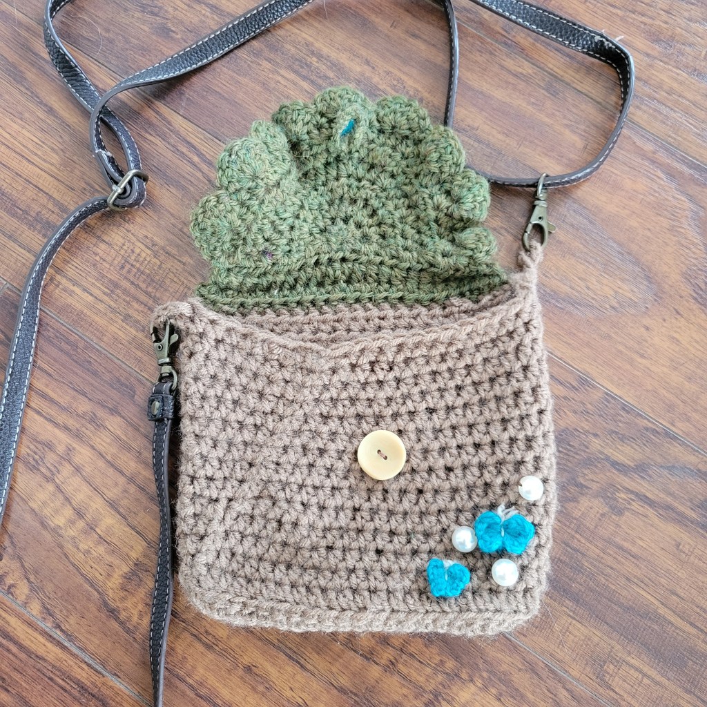 crochet woodland side bag cottage core with purple and blue butterflies open