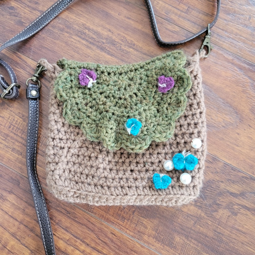 crochet woodland side bag cottage core with purple and blue butterflies flat